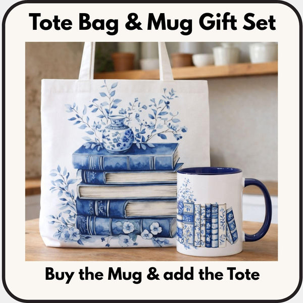A white tote bag with a blue floral design and a stack of blue and white books, along with a matching blue and white mug, are displayed on a wooden surface.