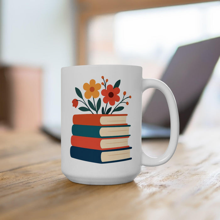 A tote bag with a floral design on it, featuring a stack of colorful books with flowers on top.