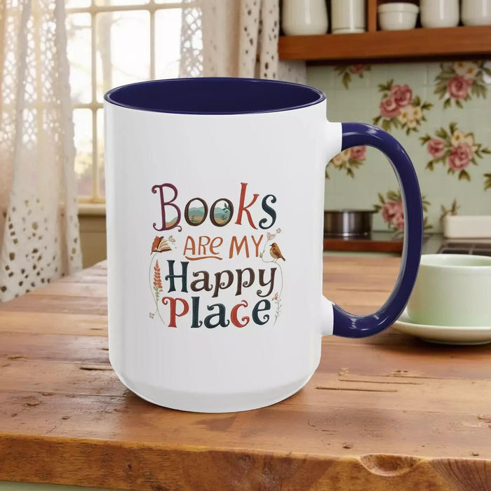 A tote bag and a mug with the text "Books are my Happy Place" printed on them, along with a book and a pen.