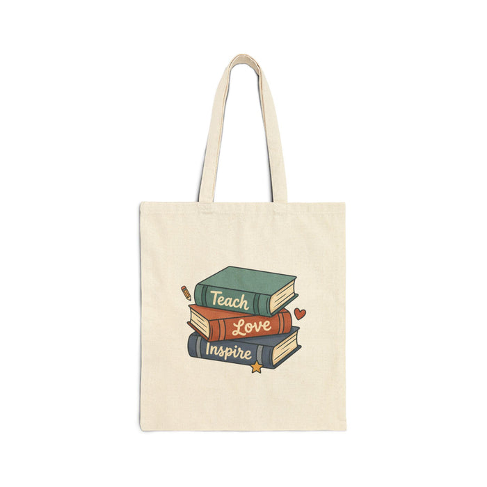 a book wrapped in brown paper with a heart-shaped tag that reads "For a Teacher who Inspires", along with other school supplies such as pencils, a chalkboard, and flowers.